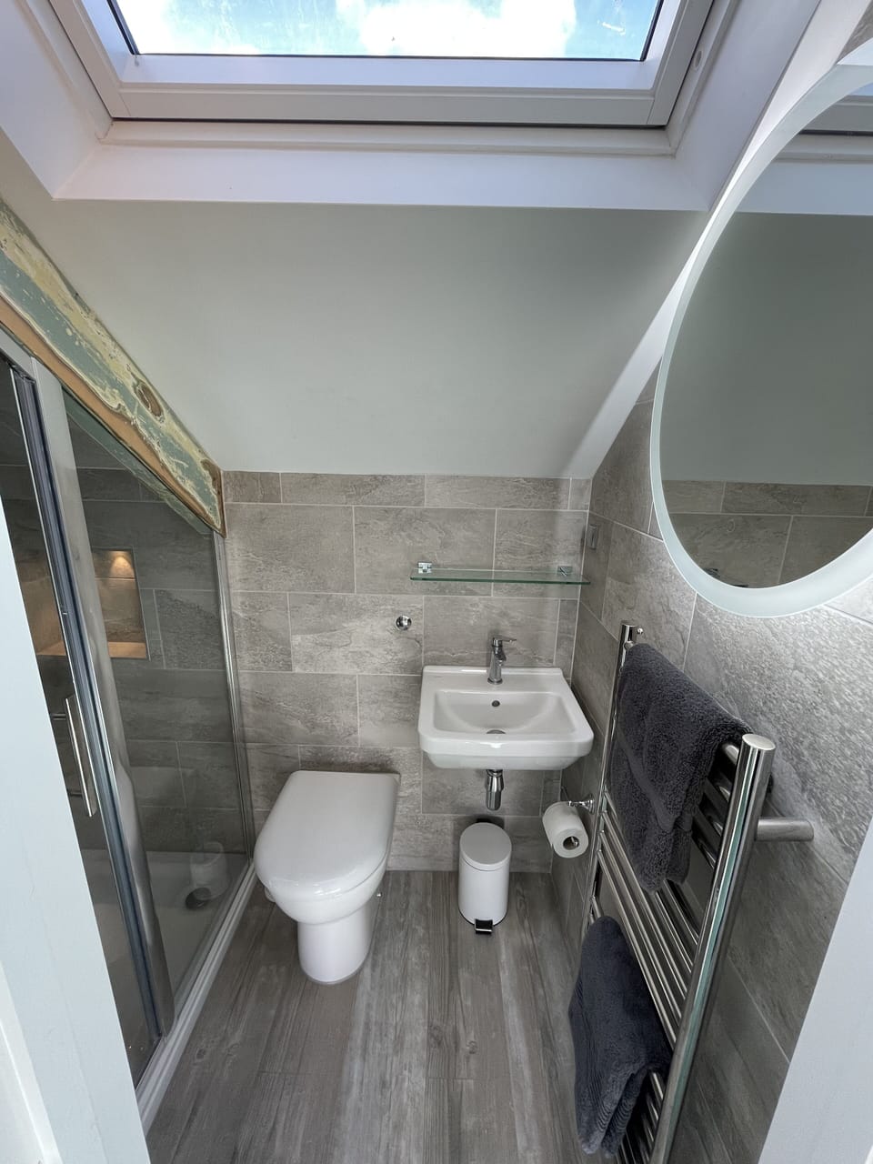 Ensuite shower room complete with heated towel rail