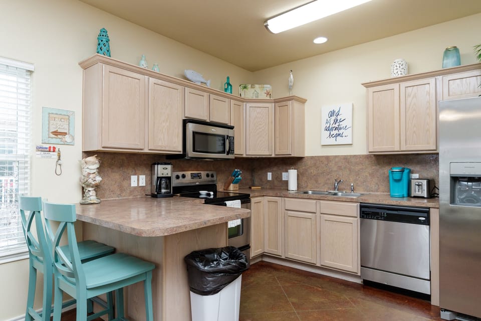 Your fully equipped kitchen features everything you need to create delicious meals, with coastal-inspired touches adding charm to your culinary adventures.
