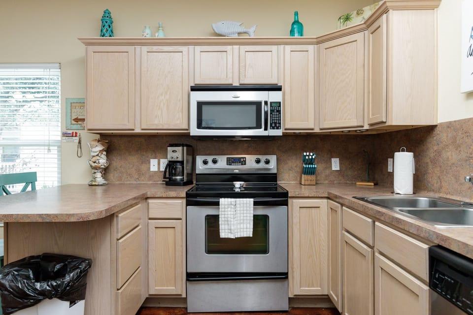 Your fully-equipped kitchen awaits with stainless steel appliances, granite countertops, and everything needed to create memorable meals during your stay.