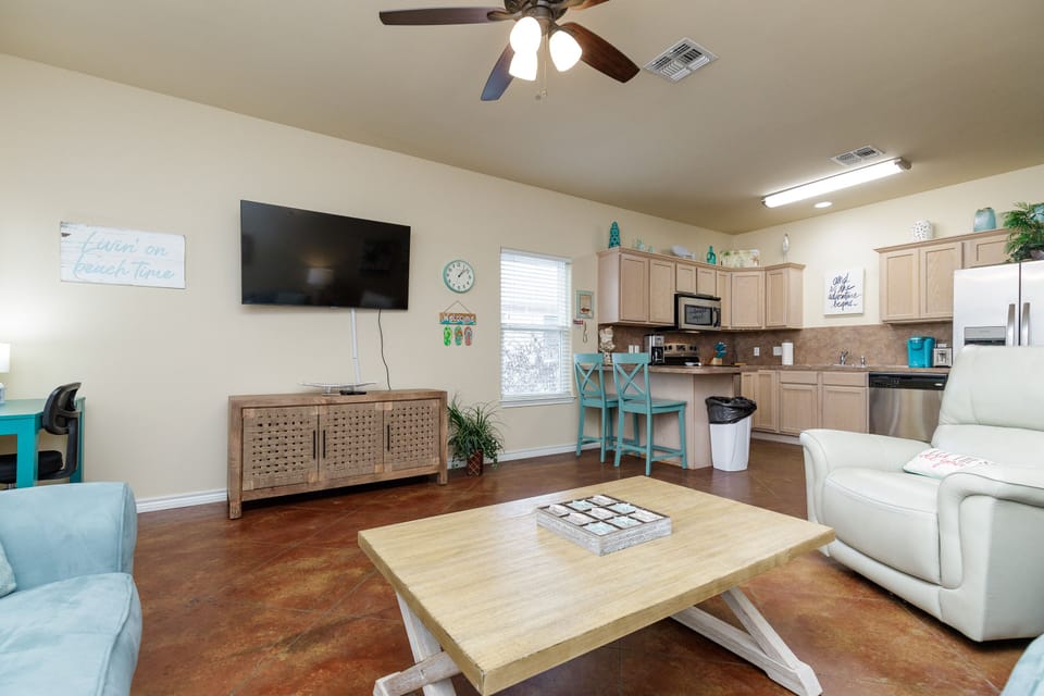 Relax in your open-concept space with comfortable seating, full kitchen, and entertainment center—perfect for unwinding after exploring.