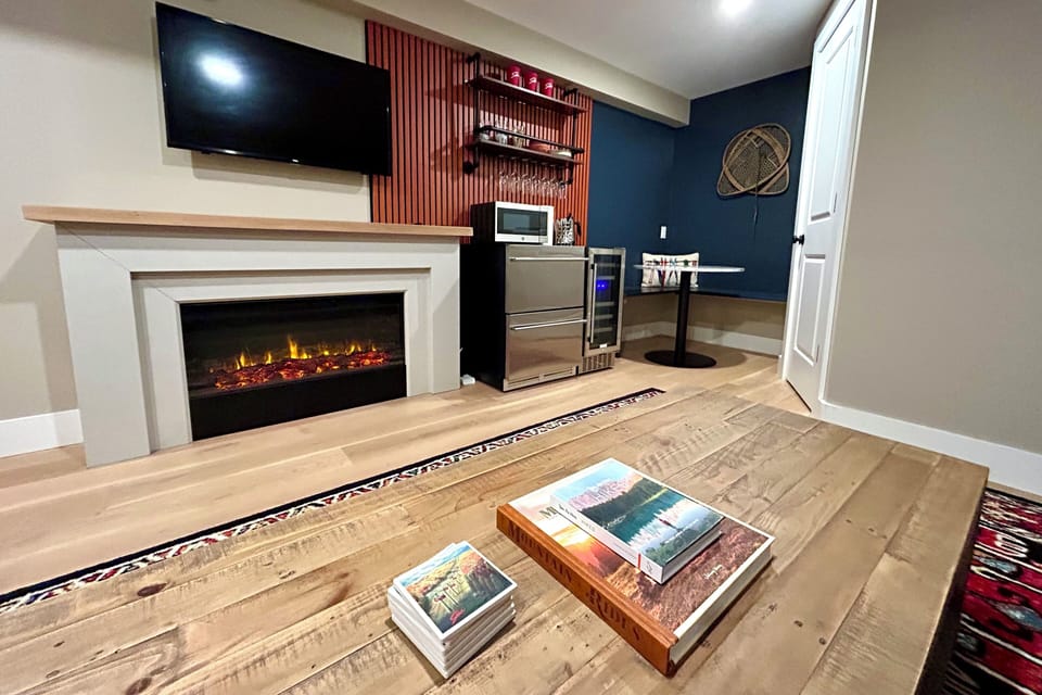 Lower level bonus room with full bath, kitchenette, living room & dining area.