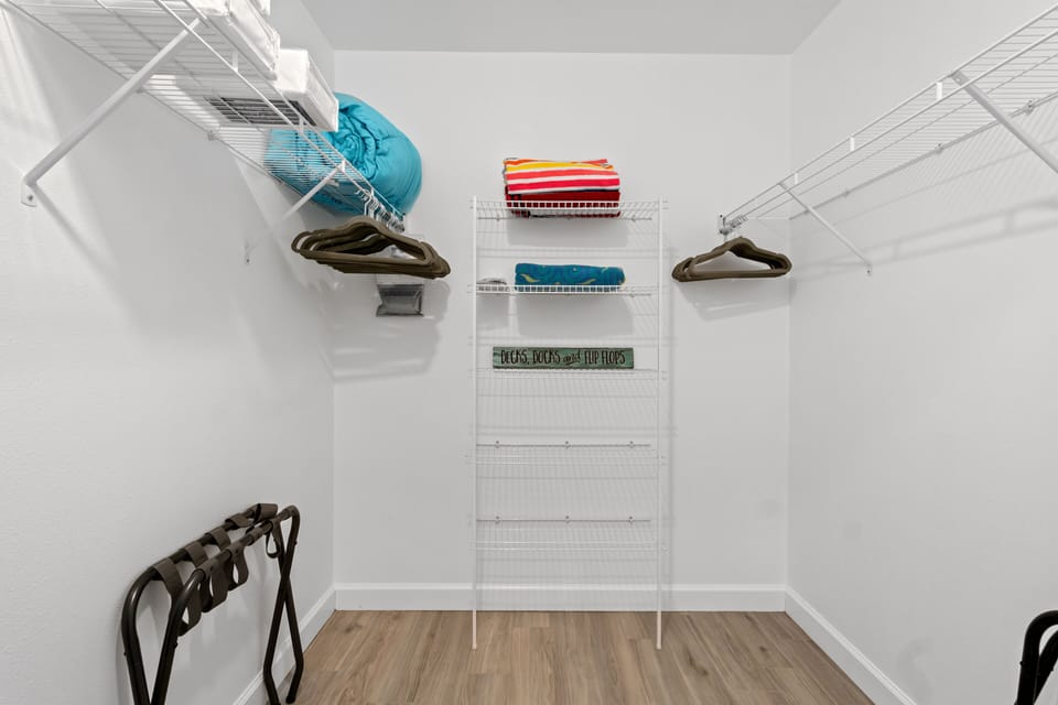 Walk-in closet in master bedroom ready for you to make yourself at home