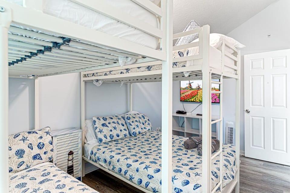 Upper level bunk room with two twin over full bunk beds