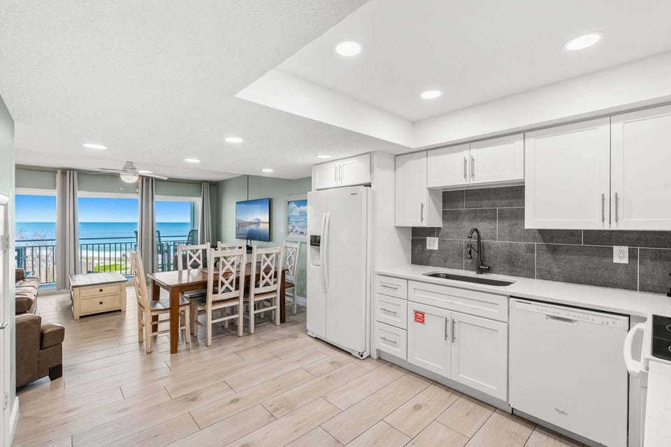 Sleek white cabinetry and stainless steel appliances