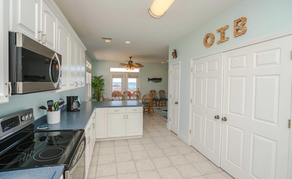 Kitchen looking towards the ocean and dining 