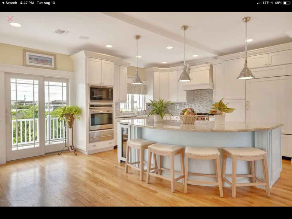 Balcony and views from the main level with kitchen and living room. 