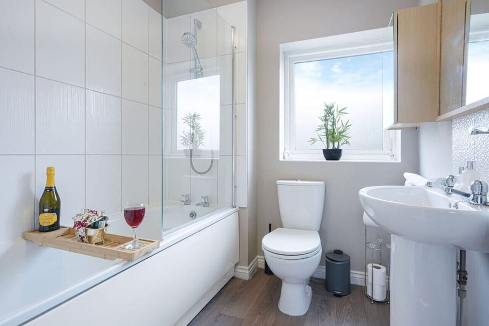Bathroom with a shower over bath and complimentary toiletries provided.