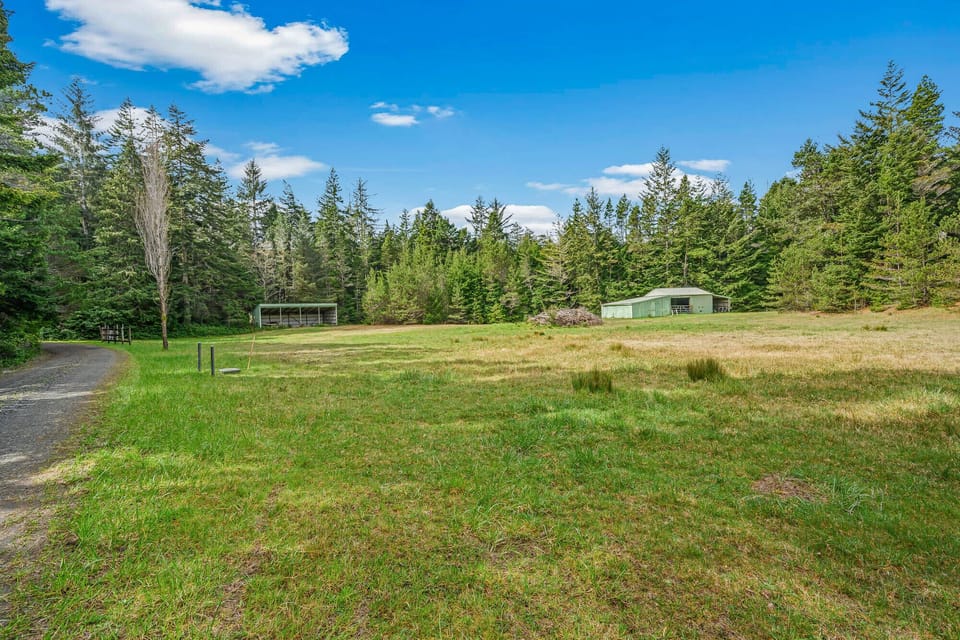 Extra parking area in field. There is 1/2 mile of gravel road off Highway 101 to reach house.