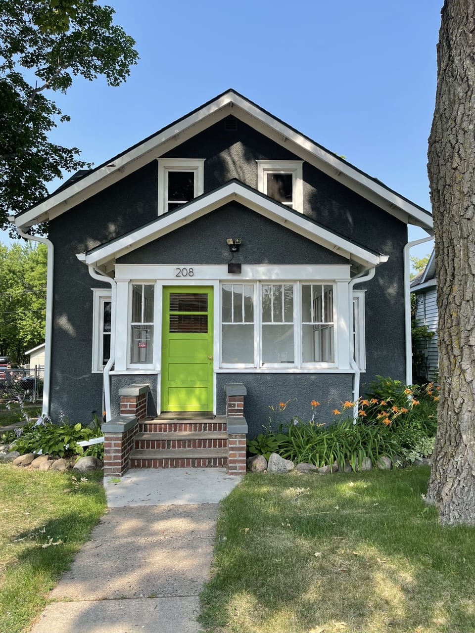 street view w/ 2 off street parking spots in driveway, 2 more in back 