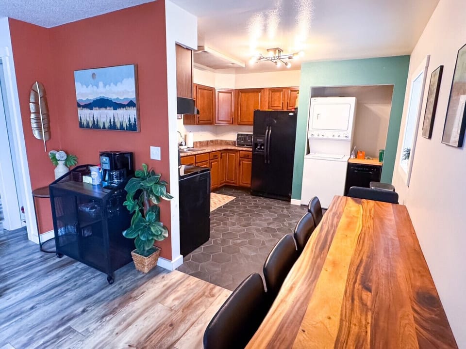 Open layout flowing from living, to dining, to kitchen. In-unit laundry, coffee bar, and fully stocked kitchen are just a few of the amenities you`ll get to enjoy!