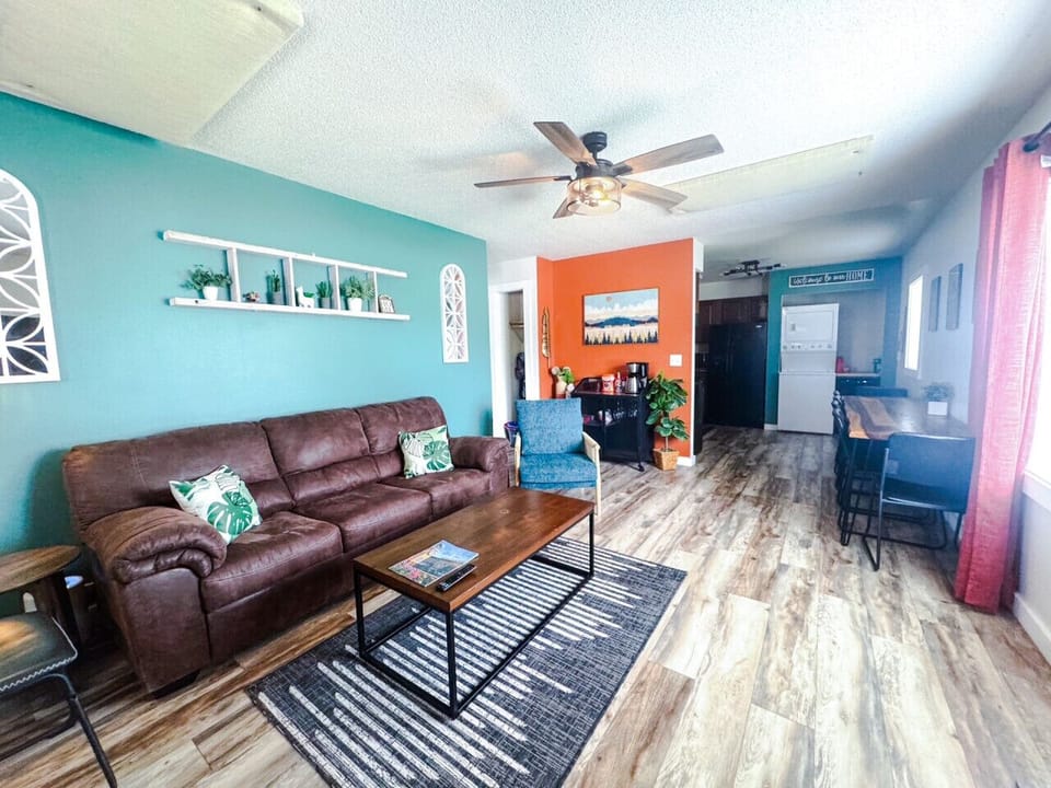 Open flow living, dining, kitchen with coffee bar, laundry in unit, and plenty of seating.