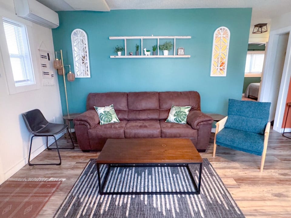 Living room with queen sleeper sofa for sleeping up to 6 guests in the apartment.