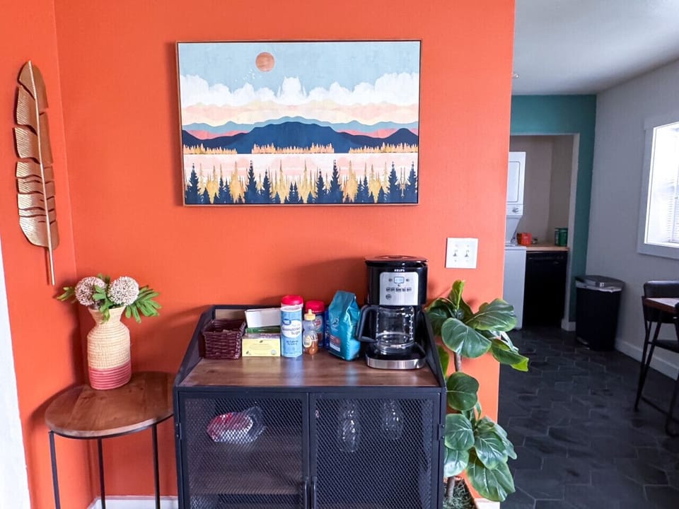 Coffee bar with grounds, teas, creamers, and sweeteners provided.