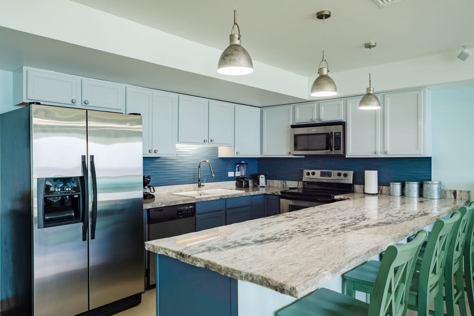 Stainless Steel Appliances and thick hand cut marble countertops