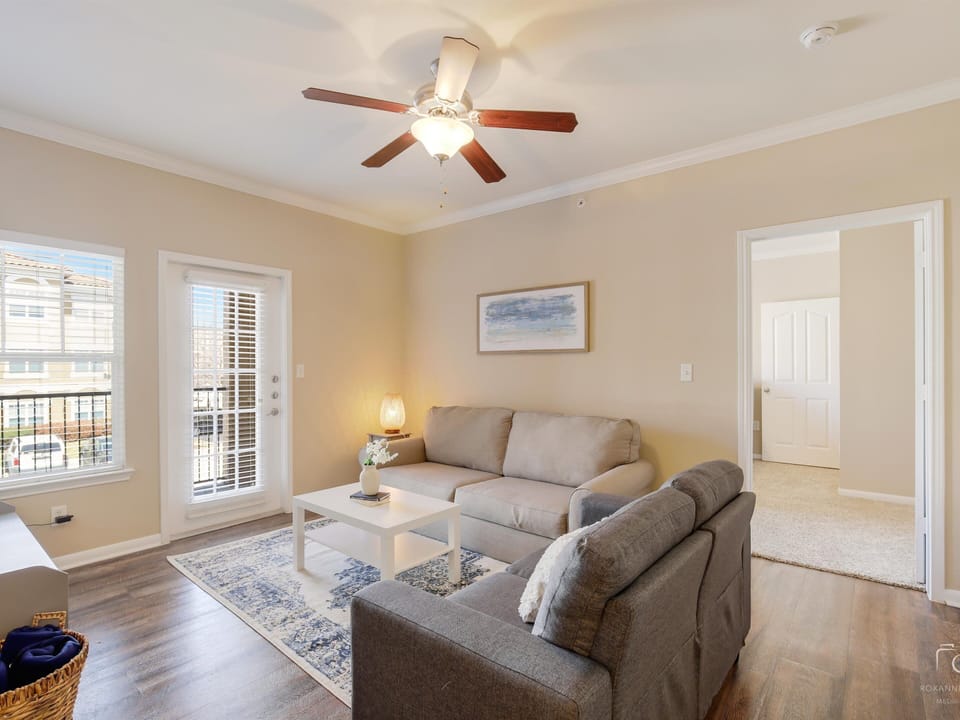 Living area with Queen Sleeper Sofa, SMART TV,  and balcony