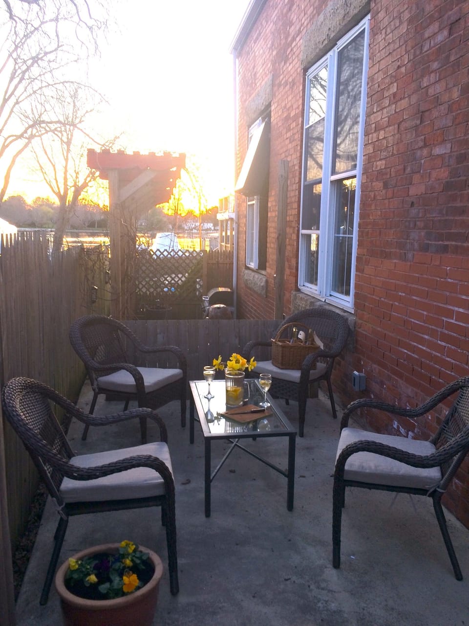 Enjoy the sunset over the water on your private patio right outside your door.