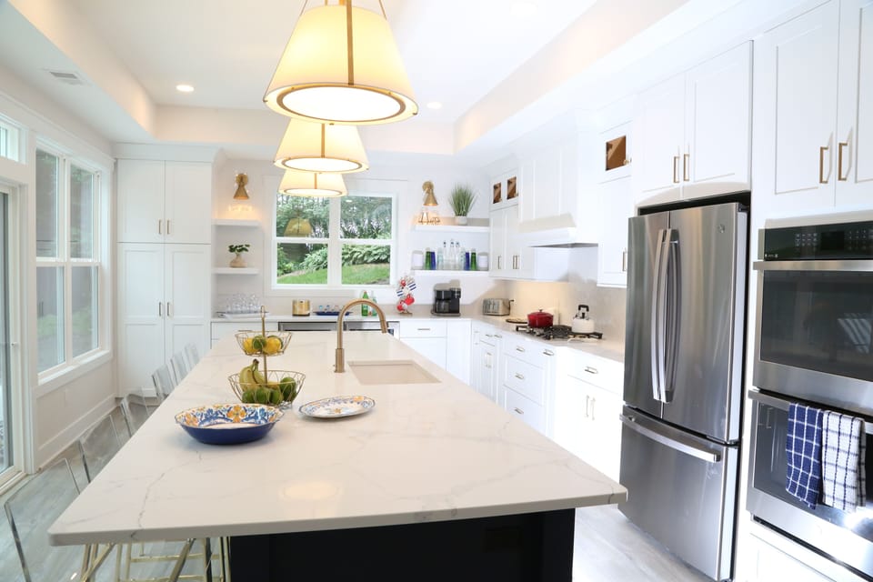 Chef’s kitchen with 13’ island, double oven, full refrigerator & beverage fridge