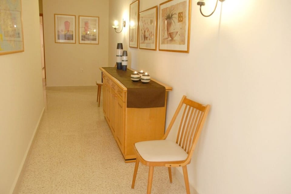 Hall leading from the living area to the bedrooms and bathrooms