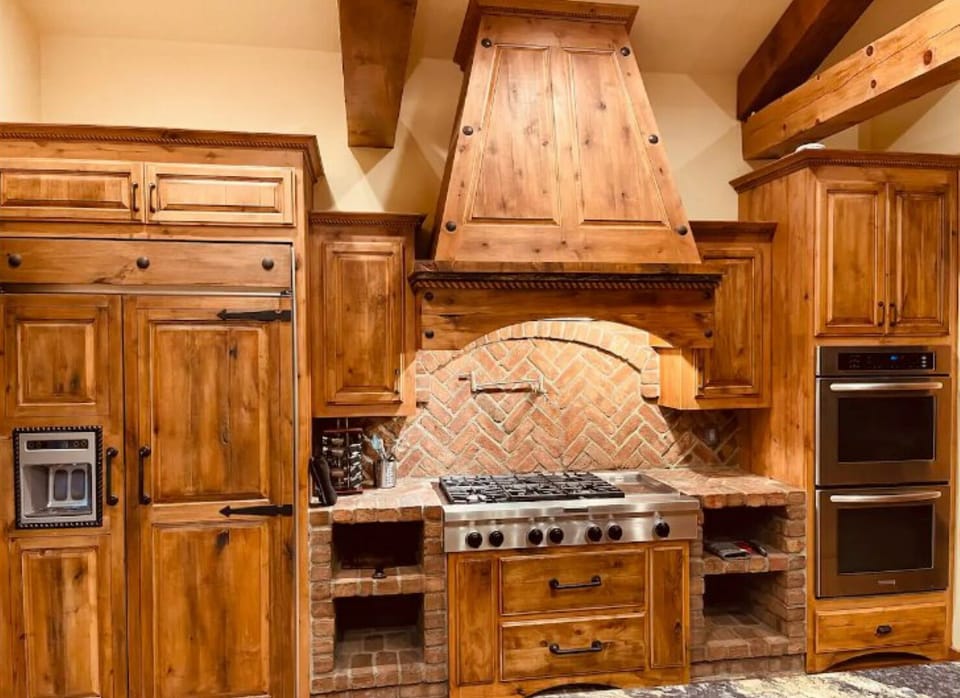 Custom Builtin with Kitchen Aid appliances and charming brick accents