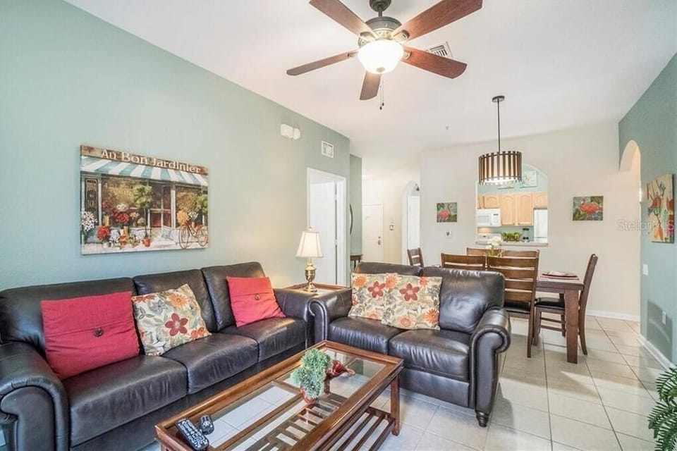 Living room with new leather couches and decor