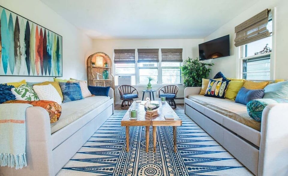 Boho-beach living area with two twin daybeds with trundles (4 twins)