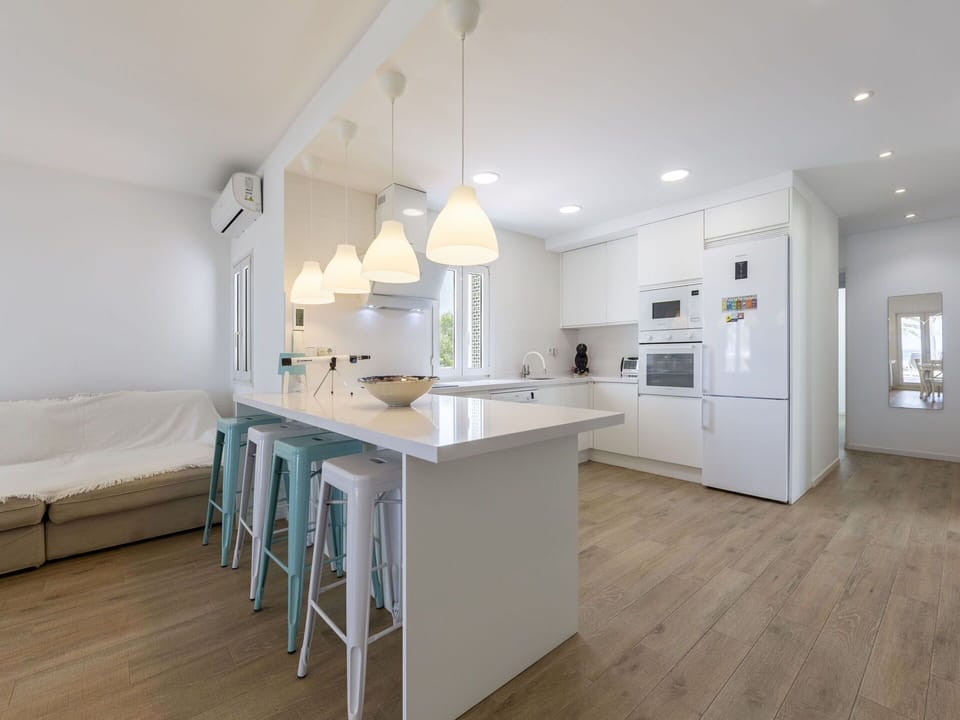 Furniture, Interior Design, Flooring, Kitchen, Countertop, Floor, Light Fixture, Wood, Ceiling, Wood Flooring