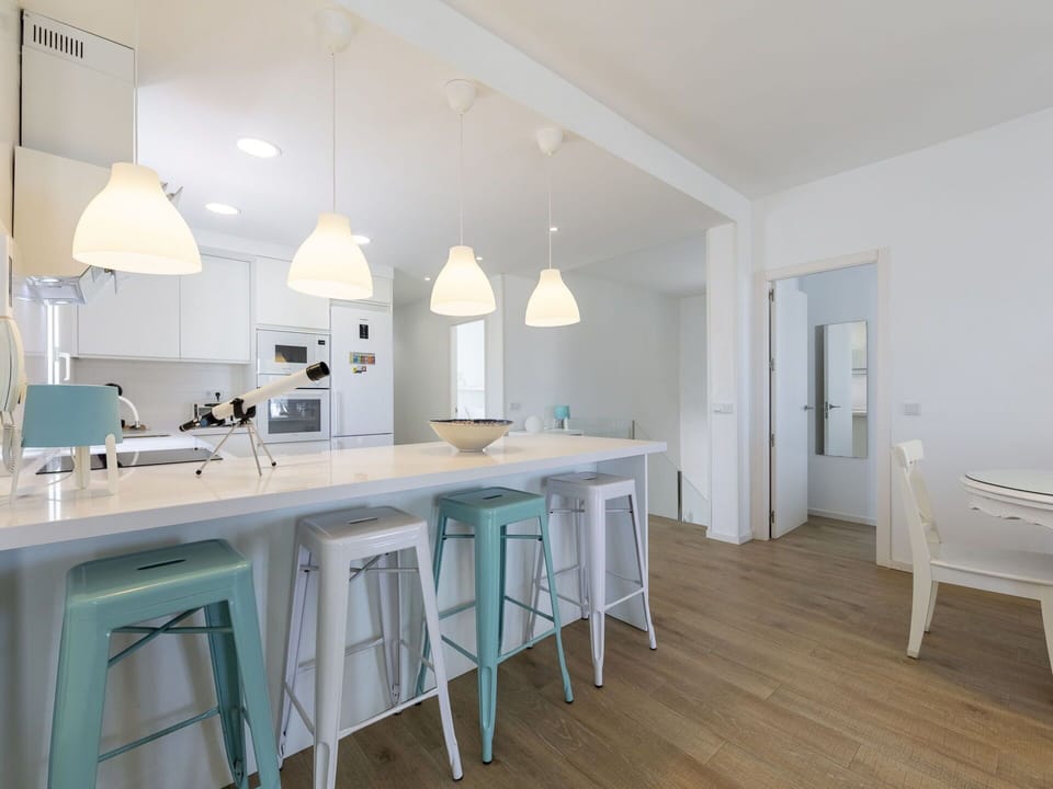 Furniture, Interior Design, Flooring, Floor, Kitchen, Wood, Ceiling, Countertop, Light Fixture, Chair