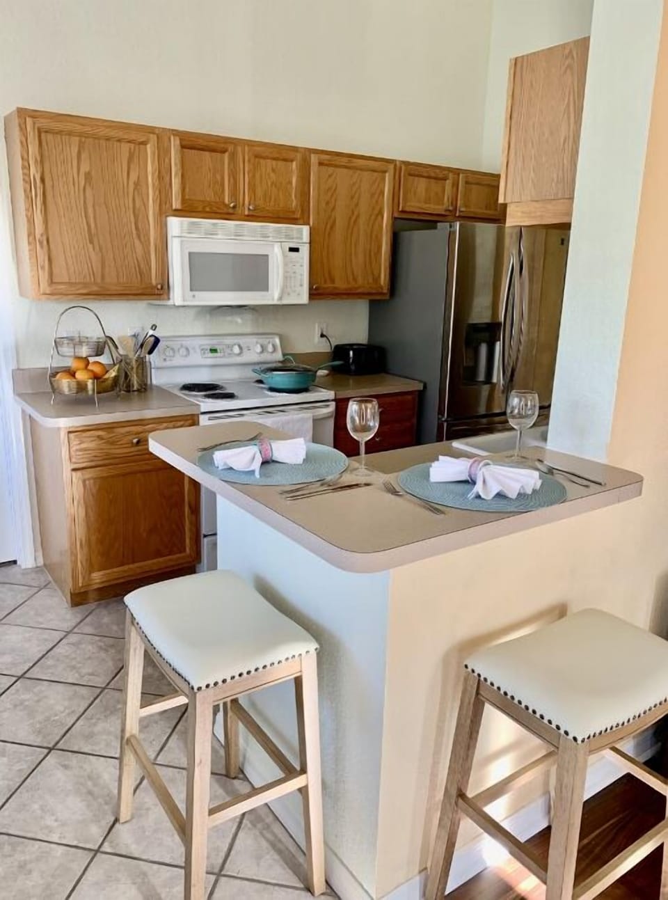Kitchen with seating at the bar area.