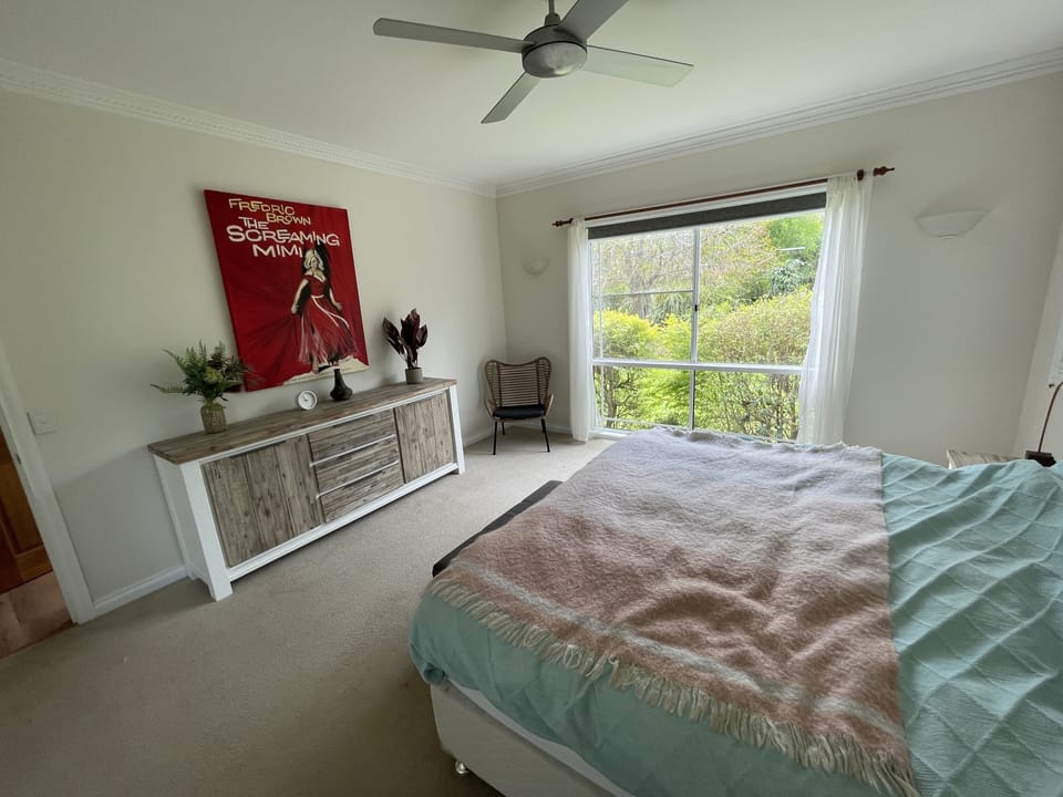 Bedroom 1. Large space, king bed, ensuite, air con and fan, mirror, chair