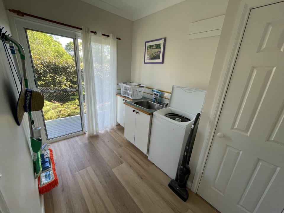Laundry with washing machine and dryer (on the deck outside)