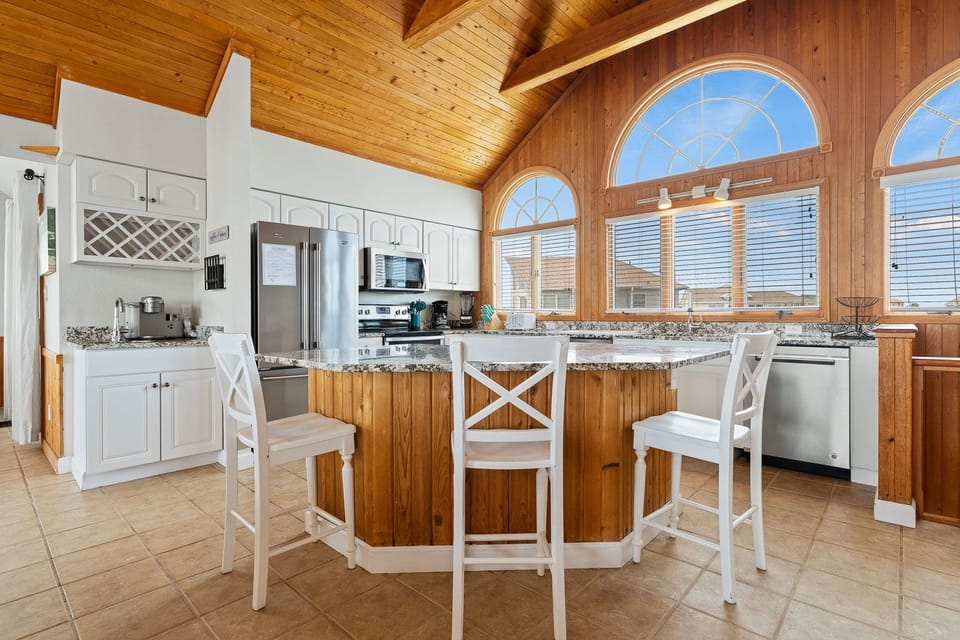 Kitchen with Bar Stool Seating on Third Level