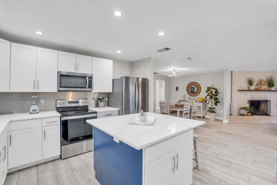 The Kitchen is Quite Inviting as it Opens Up to the Family and Dining Spaces