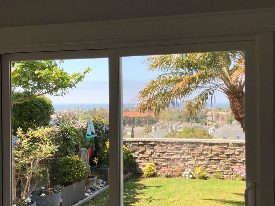 Wonderful backyard with BBQ and covered patio and ocean views!