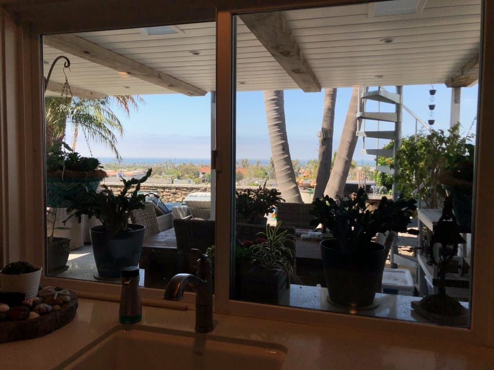 Covered patio with dining area and ocean views!