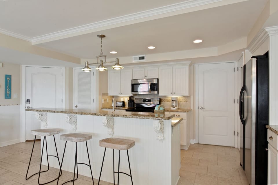 Kitchen with granite and stainless steel appliances