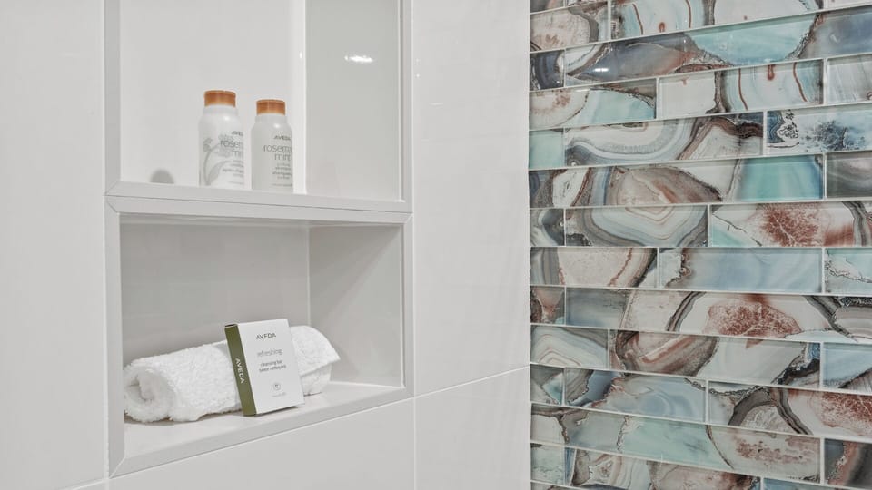 Freshen up in your spa-inspired bathroom with plush towels and premium toiletries thoughtfully provided for your comfort.