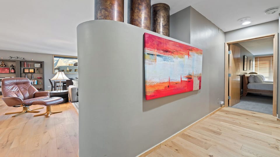 Step into your stylish retreat with modern art welcoming you. The open layout flows effortlessly from living room to bedroom, blending comfort and contemporary design throughout.