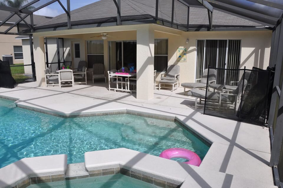 Large beautiful pool and spa with covered lanai and plenty of seating for all.