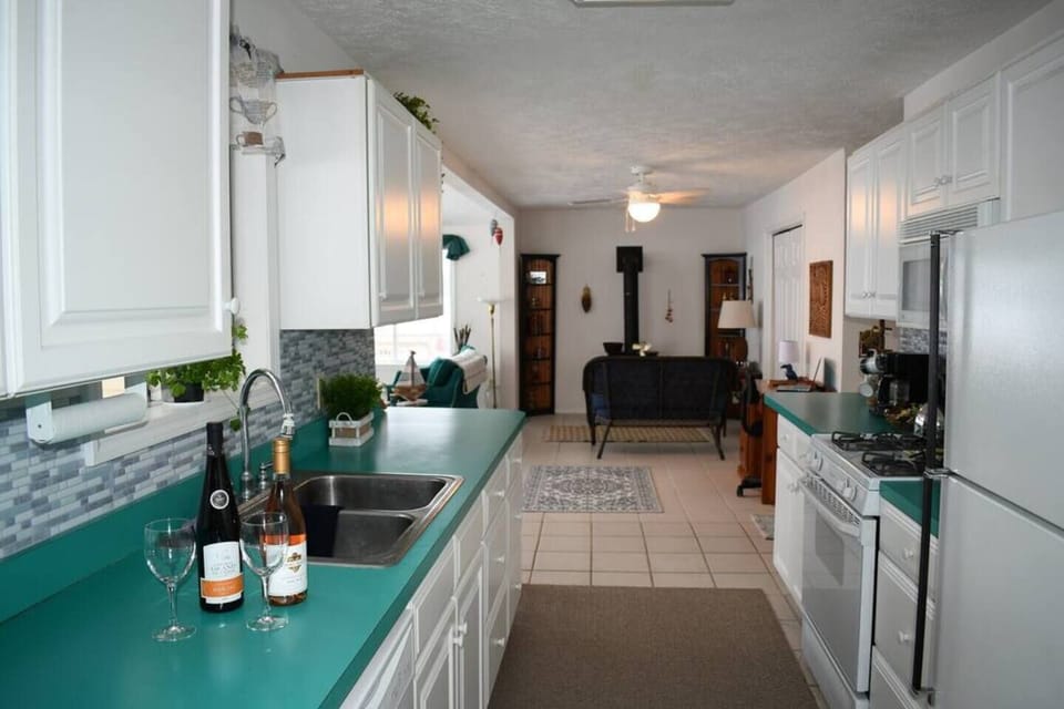 Looking down the kitchen to the Den from the main access door 