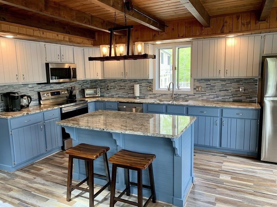 Beautiful open kitchen with granite countertops and island