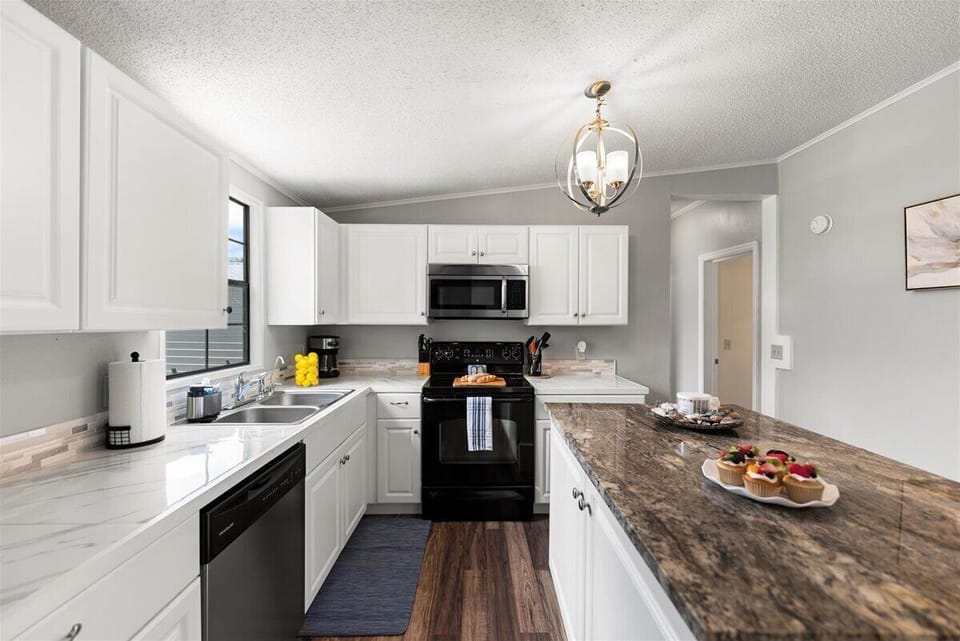 Fully equipped kitchen with modern appliances and ample counter space.
