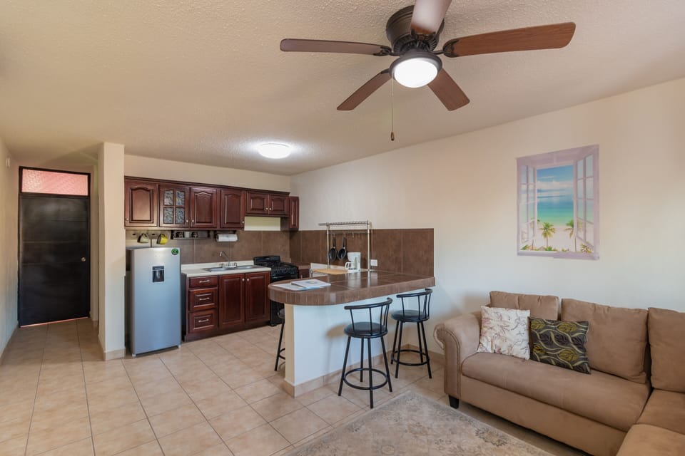 This furnished apt has its own kitchen and living room.