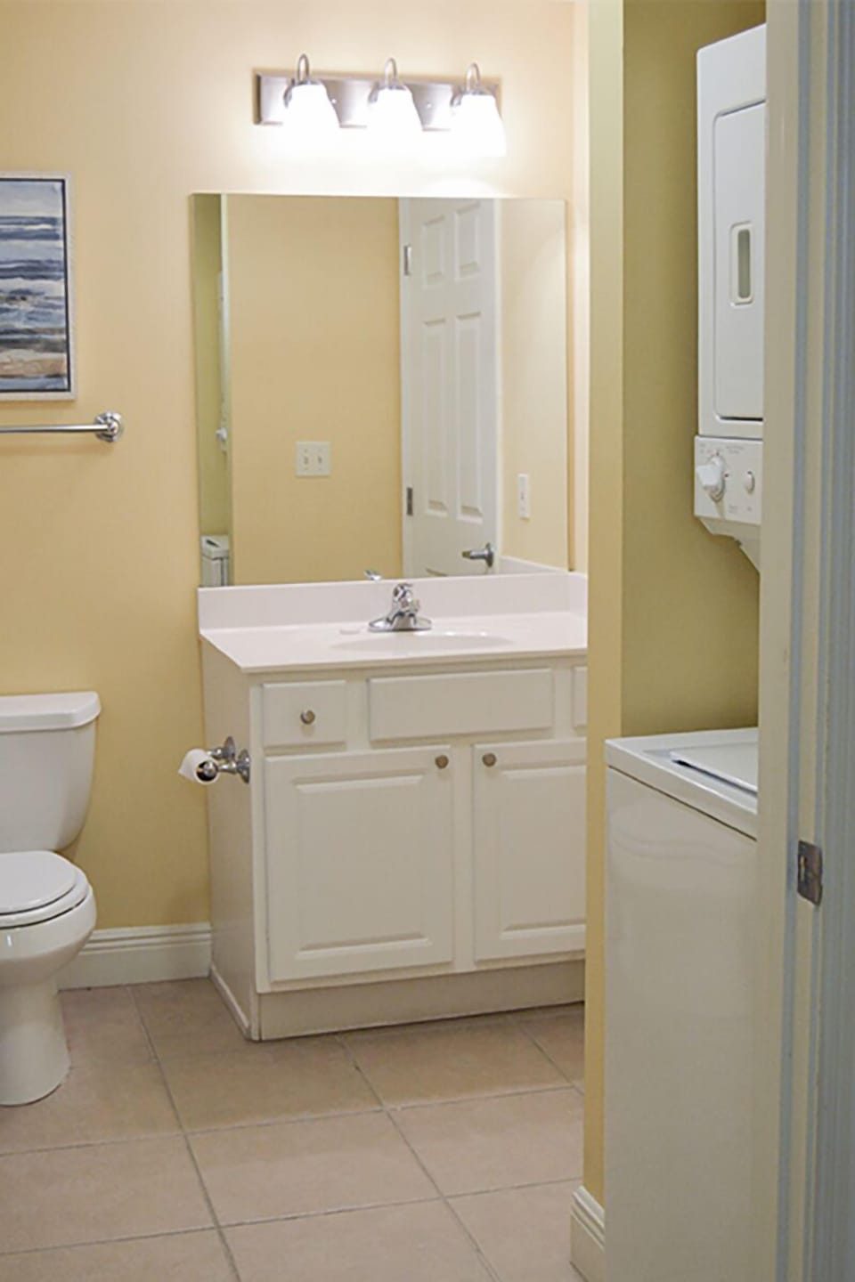 Full bathroom with laundry area