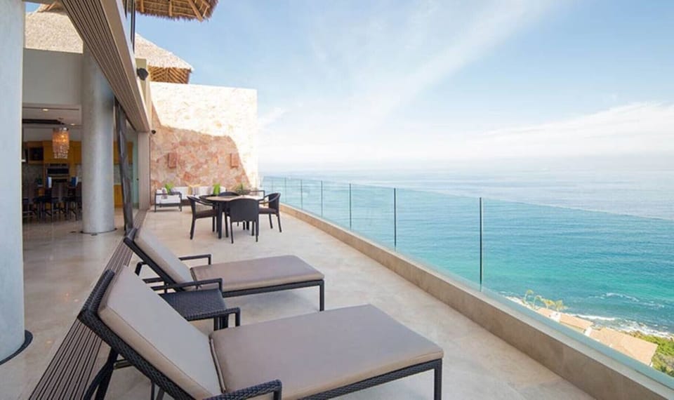 The open plan living space transitions invisibly to the outdoor lounge.