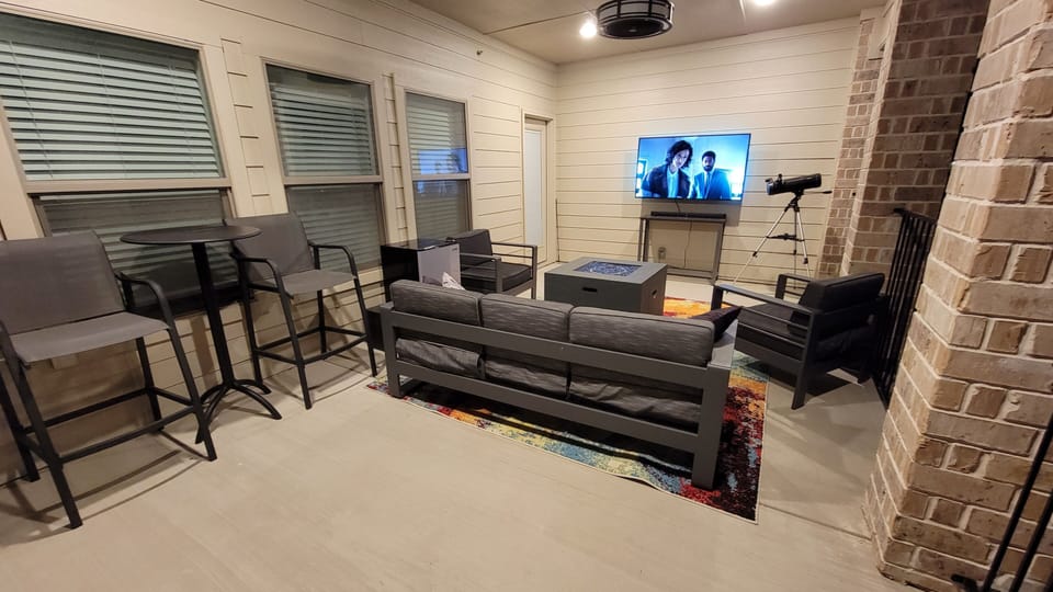 Sit on our 3rd floor balcony over the firepit and mounted tv and enjoy the views