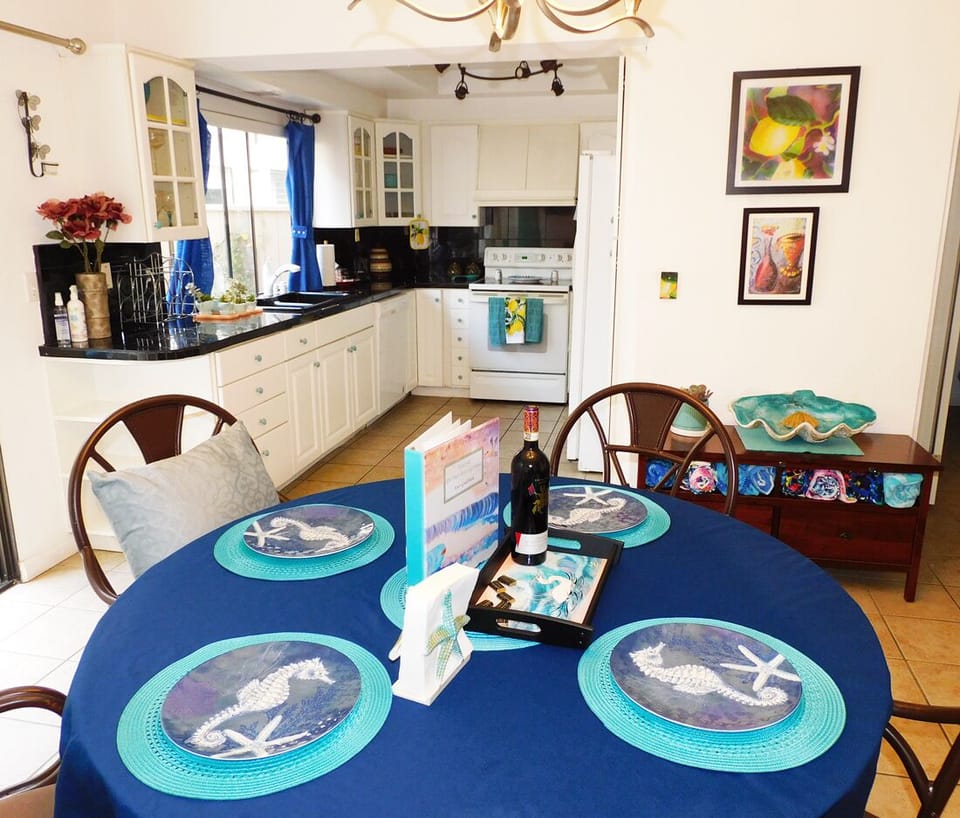 Kitchen dining area embellished with coastal decor.