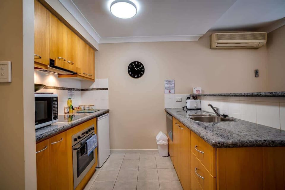 Enjoy the convenience of a full kitchen during your stay! Complete with a fridge, oven, microwave, and ample storage, it's perfect for preparing your favorite dishes.