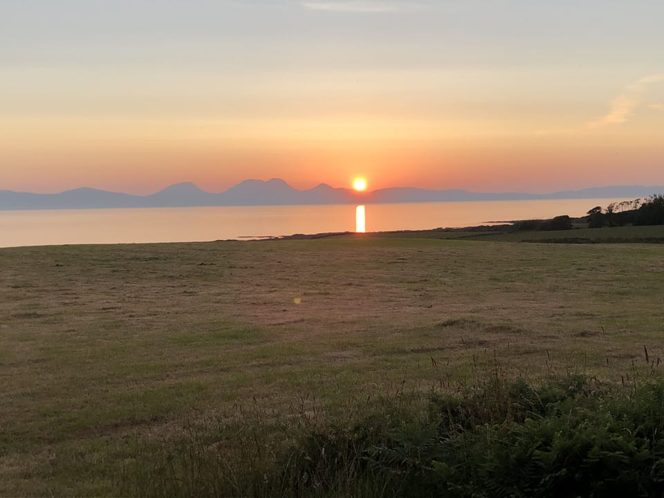 Sunset view of Islay & Jura from Kilberry Head.
