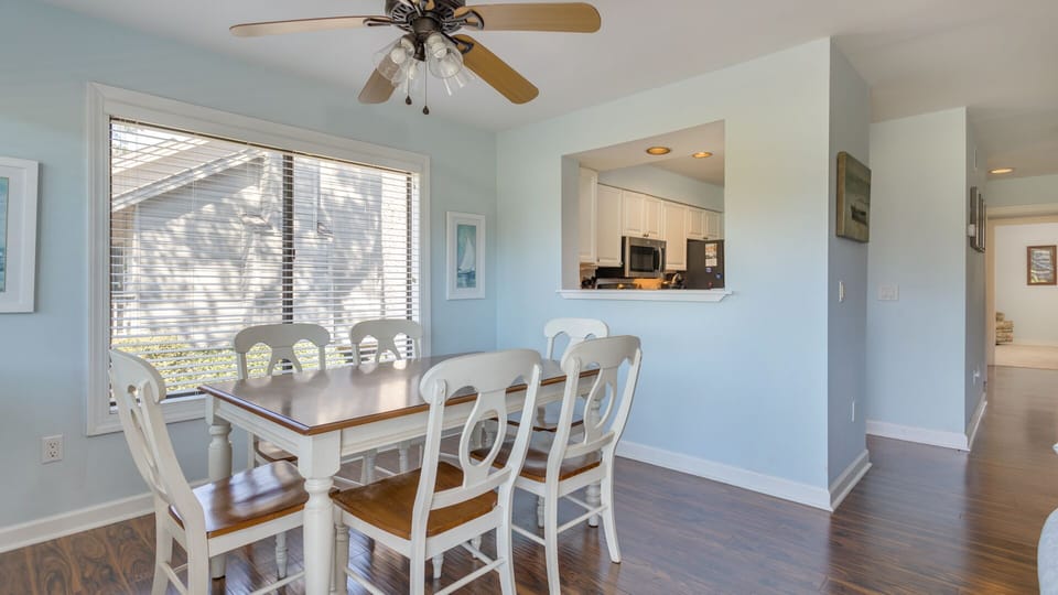 This bright dining area is ideal for shared meals and easy entertaining, with a convenient pass thru to make them effortless.