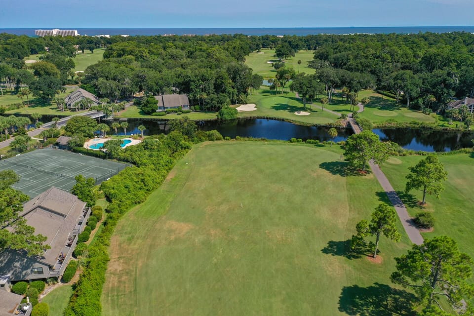 Mature trees and winding paths create a peaceful setting for golfers and walkers alike.
